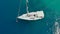 Sailing regatta, boat trip, top view. White yacht in the blue sea, drone video.