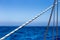 Sailing Ropes in Front of bight blue Ocean and Sky Background