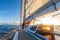 Sailing on sailboat yacht with beautiful sunset light clear blue sky and flat sea in drake passage, summer cruising, closeup of