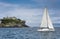 Sailing on a sailing boat along the Cantabrian coast with calm sea.