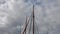 Sailing ship mast against the sky on sailing boats with rigging details