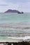 A sailing ship moored by North Seymour Island, with a smaller island in the background, Galapagos Islands, Ecuador