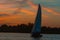 Sailing into the sunset. Sailboats regatta