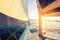 Sailing at sunset. A view from the yacht\'s deck to the bow and sails