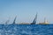 Sailing super yacht with black sails is racing in the Med