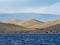 Sailing on a yacht along the landscape of rocky and wavy desert islands in Kornati national park in summer Croatia, Mediterranean