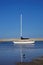 Sailing yacht anchor in shallow water, portrait