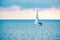 Sailing yacht in the blue calm sea