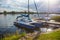 sailing yacht and catamaran moored on the lake