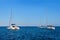 Sailing yacht catamarans, Mediterranean sea, clear blue sky and sea waters. Summer entertainment, fun sailing, swimming