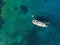 Sailing yacht in clear waters from above