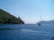 Sailing yacht floating near a coast of greenland.