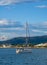 Sailing yacht, sailboat in the bay on city landscape background