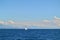 Sailing yacht and the sea. Land outline in the distance. Croatia.