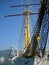 Sailing yacht stands at the pier. Beautiful graceful ship, mast, nets