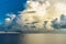 Sailing yacht in a stormy weather and huge cloud