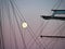 Sailing yacht tall ship illuminated by the light of a full moon