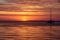 Sailing and yachting. Boat on water at sunset. Sailboats on ocean sea water.