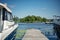 Sailing yachts, motorboats and boats moored to the pier on the yacht club