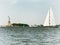 Sailingboat boating near Statue of Liberty