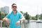 Sailor in black sunglasses on ship board. Handsome goateed man on boat looking to far. Travel tourism vacation and people concept.