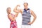 Sailor flexing bicep and his girlfriend posing with him