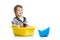 Sailor kid sitting inside washbowl