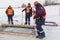 Sailors work at the lane with a fenced wooden formwork