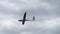 Sailplane in cloudy sky