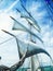 Sails, mast and ropes view from below of a classic sailingship.