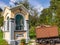 Saint Barbara Chapel with mining Vehicle near Graveyard and Mining Tunnel in Log pod Mangartom, Bovec, Slovenia, Europe