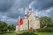 Saint-Famille de-l\\\'Île-d\\\'Orléans church scene on a dark stormy sky