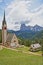 Saint Giacomo church near Santa Cristina and Ortisei with Sassolungo and Sassopiatto mountains in the background, Val Gardena