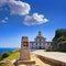 Saint James Way sign and lighthouse of Finisterre