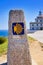 Saint James Way sign and lighthouse of Finisterre