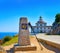 Saint James Way sign and lighthouse of Finisterre