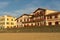 SAINT JEAN DE LUZ, FRANCE - SEPTEMBER 04, 2022: Traditional Basque houses in Jacques Thibaud walk in front of Big beach at sunset