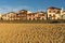 SAINT JEAN DE LUZ, FRANCE - SEPTEMBER 04, 2022: Traditional Basque houses in Jacques Thibaud walk in front of Big beach at sunset