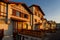 SAINT JEAN DE LUZ, FRANCE - SEPTEMBER 04, 2022: Traditional Basque houses in Jacques Thibaud walk in front of Big beach at sunset