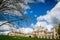 Saint John College on a bright sunny day with patches of clouds over the blue sky, Cambridge