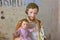 Saint Joseph holds baby Jesus, sculpture