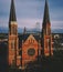 Saint Joseph`s Cathedral in Rockhampton with a bridge greenery and a sea on the background