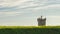 Saint Julian Fortress lighthouse behind grassland, Oeiras, Lisbon