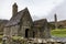 Saint Kevin`s Kitchen and the Round Tower at the Glendalough Monastic Site in Wicklow, Ireland