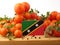 Saint Kitts and Nevis flag on a wooden panel with tomatoes isola