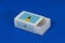 Saint Lucia flag on white box with barcode and the color of nation flag on blue background, paper packaging for put match or