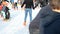 SAINT-MALO, FRANCE - NOVEMBER 27, 2016: Teenagers in orange skate on the ice skating at rink