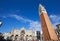 Saint Mark basilica facade, bell tower and square with crowd, blue sky in a sunny day in Italy