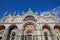 Saint Mark low angle view basilica facade in Venice, blue sky