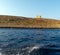 Saint Mary`s Tower, or Comino Tower, shot from the water